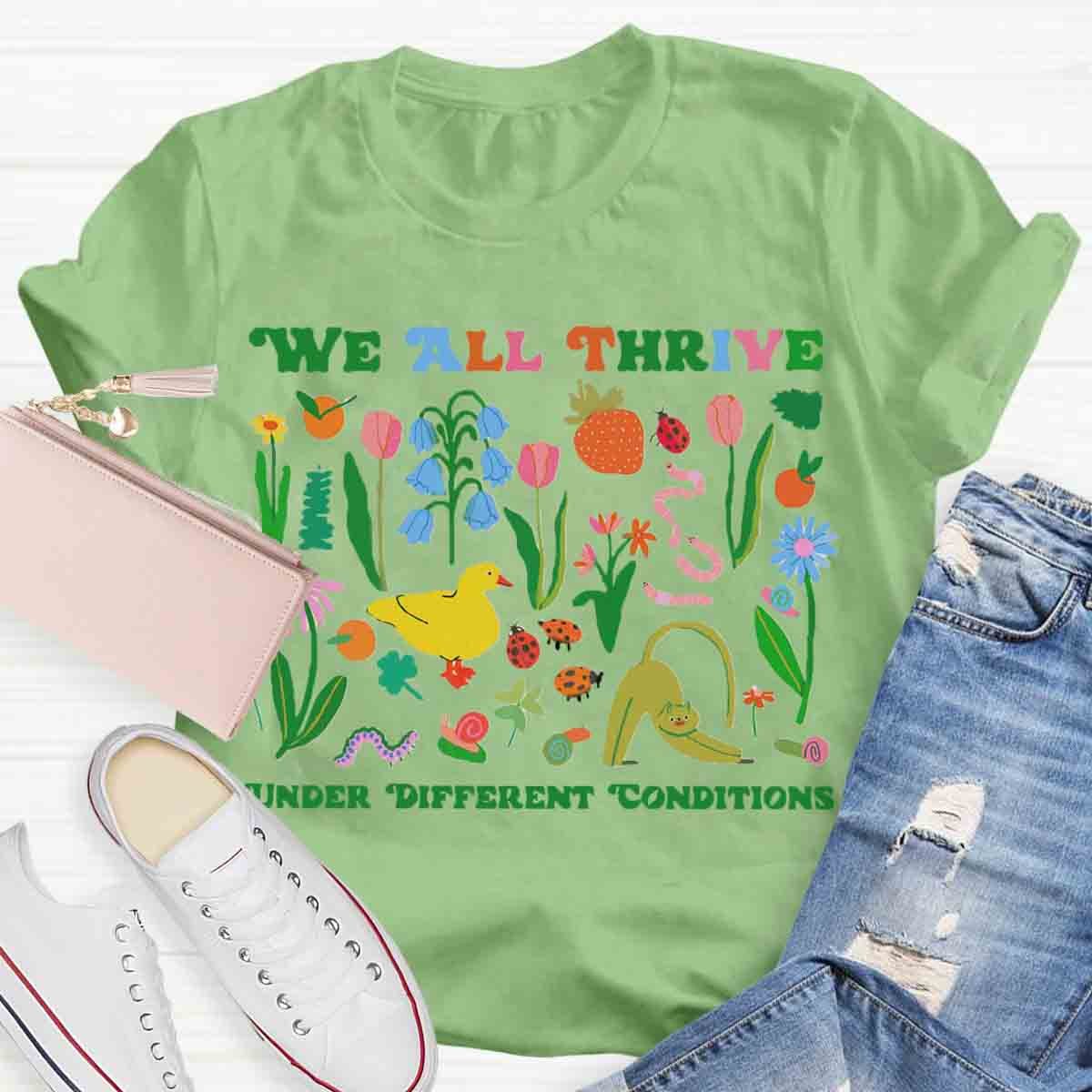 We All Thrive Under Different Conditions Teacher T-Shirt