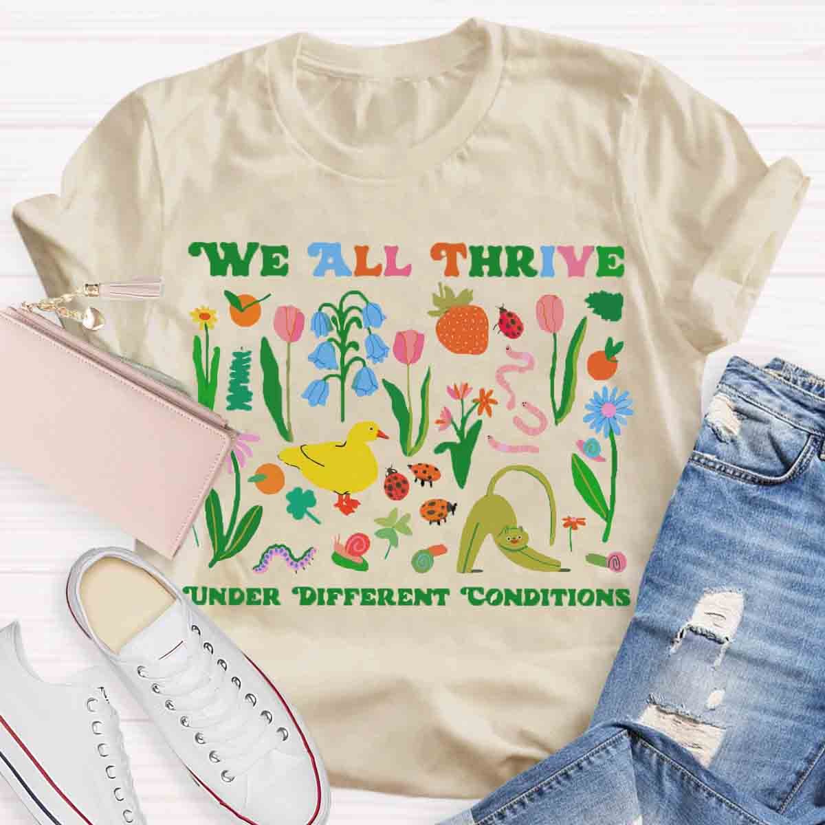 We All Thrive Under Different Conditions Teacher T-Shirt