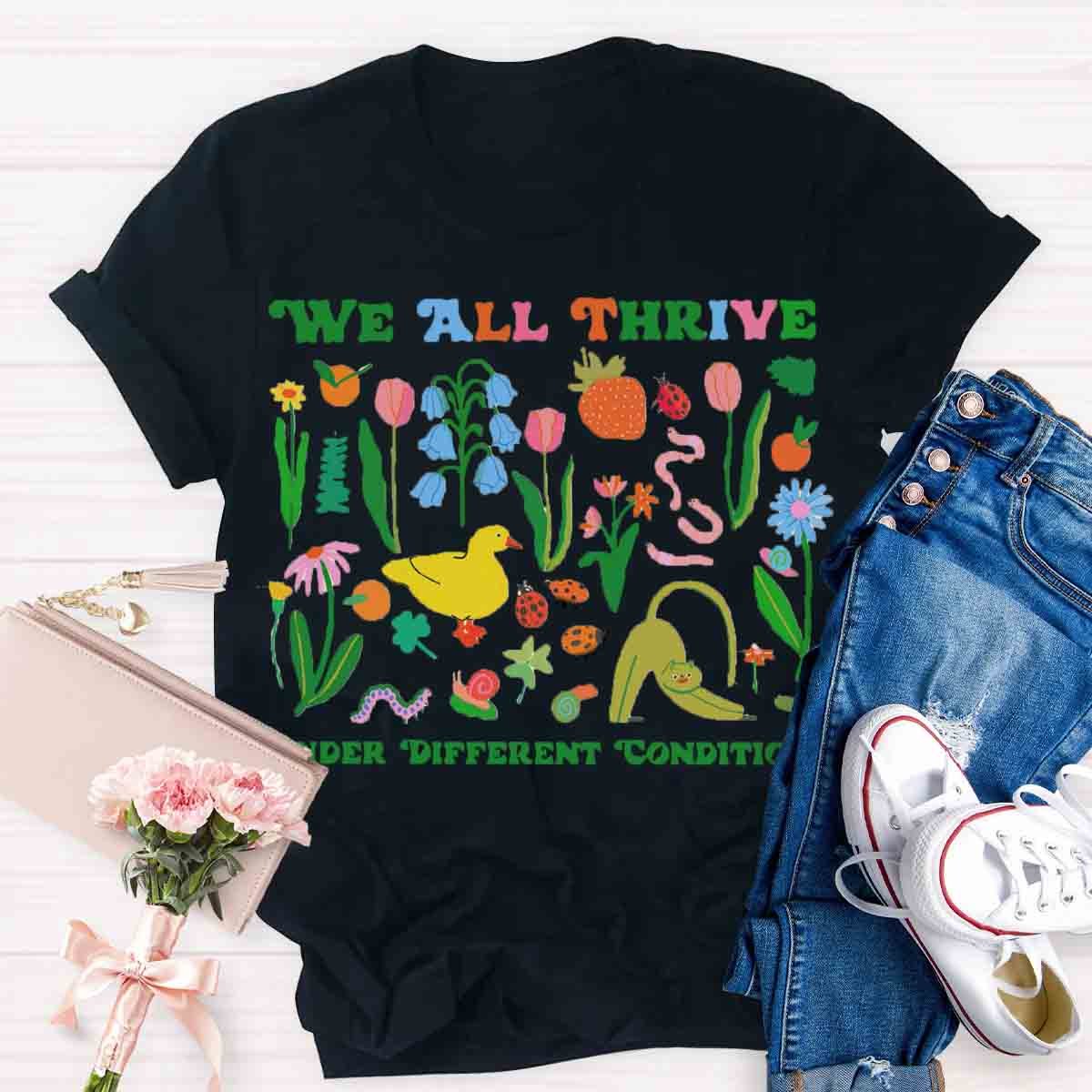 We All Thrive Under Different Conditions Teacher T-Shirt