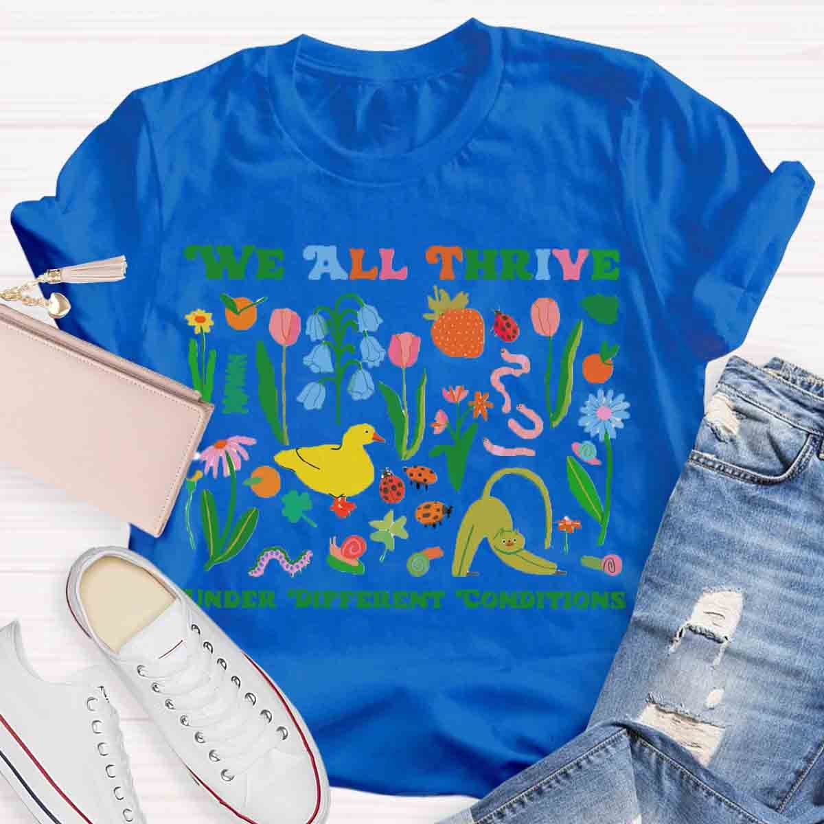 We All Thrive Under Different Conditions Teacher T-Shirt